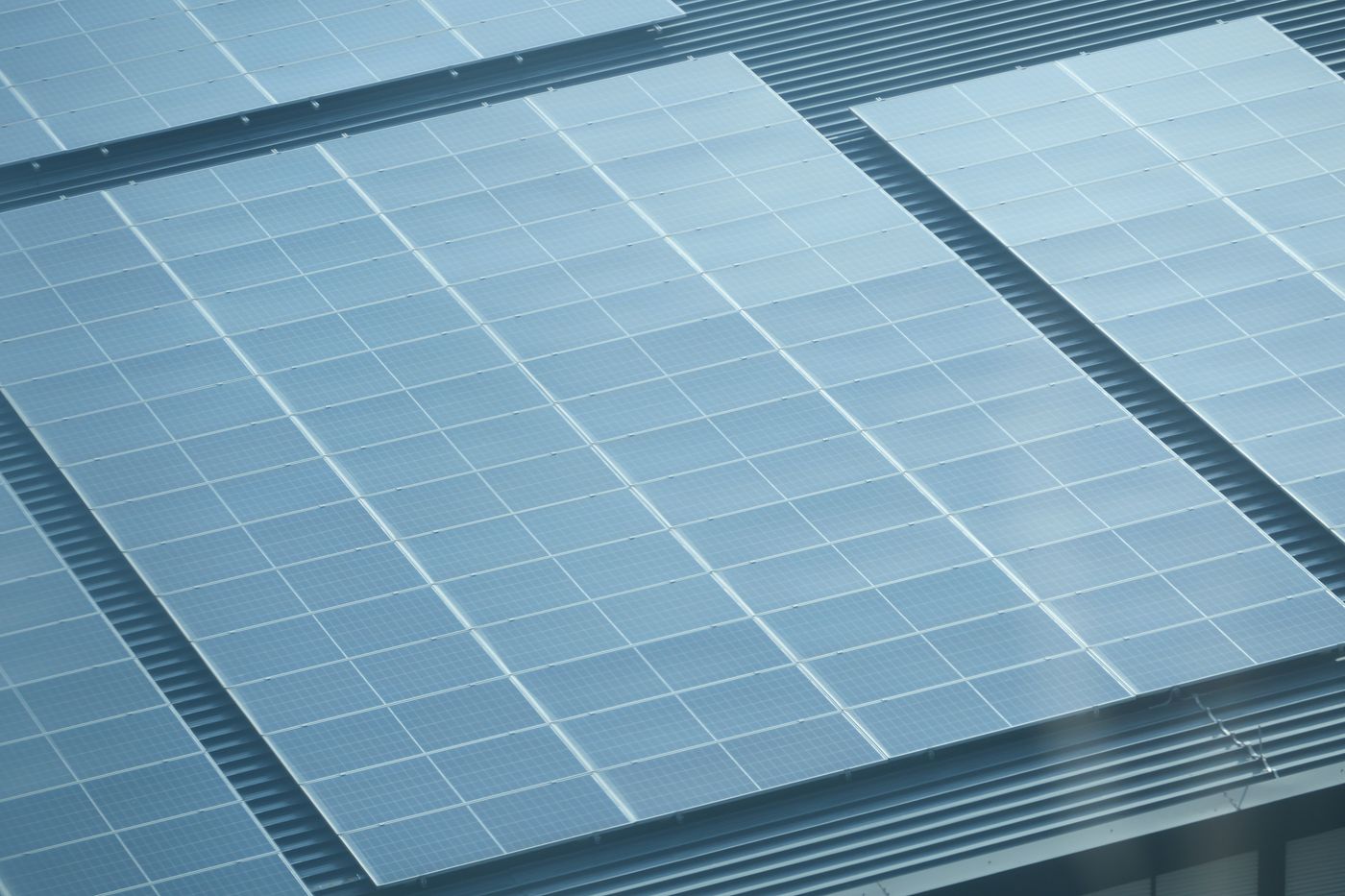 Solar panels on a building rooftop, illustrative photograph